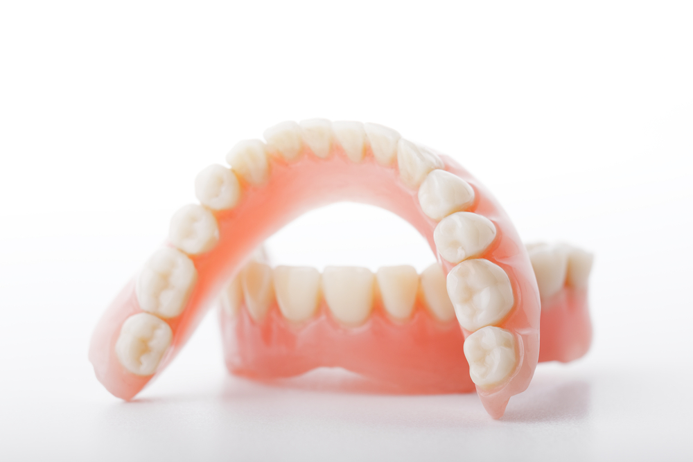 Ramsey dentures of teeth on a white background.